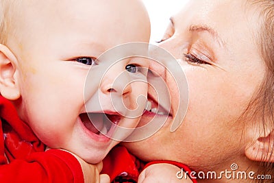 Mother kissing baby Stock Photo