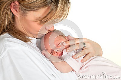 Mother kissing baby Stock Photo