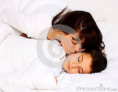Mother kissing her son Stock Photo
