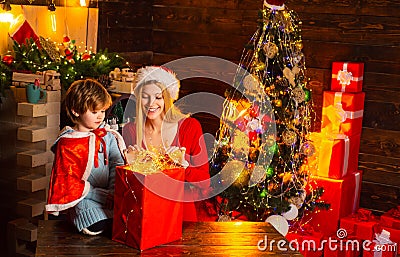 Mother and little child boy adorable friendly family having fun. Family having fun at home christmas tree. Mom and kid Stock Photo