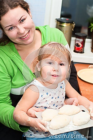 Mother and little child cooking Stock Photo