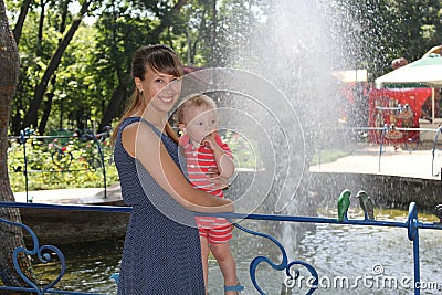 Mother and little son having fun outdoors in the Fairy Glade Stock Photo