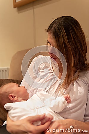 Mother looking at newborn Stock Photo