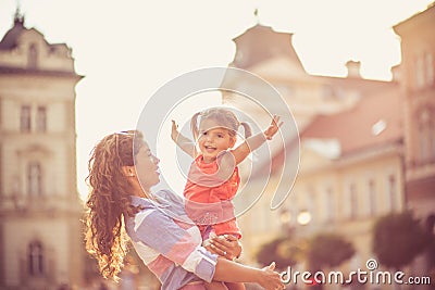 Mother makes me believe I can do anything, even fly. Stock Photo