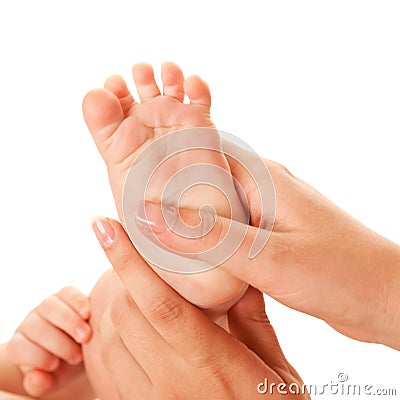 Mother making baby foot massage. Stock Photo