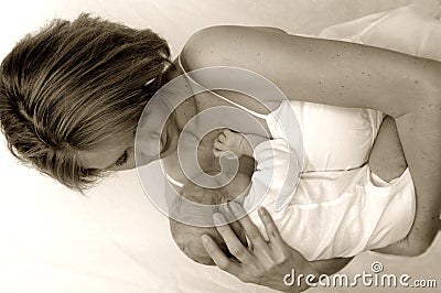 Mother and newborn baby sepia Stock Photo