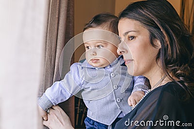 Mother parenting her baby boy with affection Stock Photo