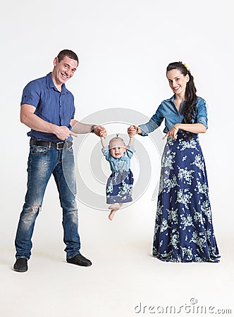 Mother playing with her daughter holding her in his arms Stock Photo