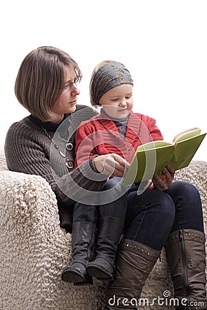 Mother reading a story to her little daughter Stock Photo