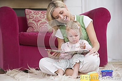 Mother reading to daughter Stock Photo