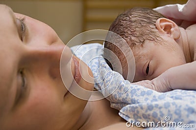 Mother resting with her baby Stock Photo