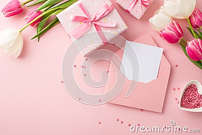 Top view photo of gift boxes bunches of pink and white tulips open envelope with letter and heart shaped saucer with sprinkles Stock Photo