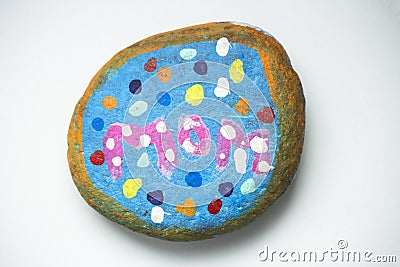 Mother`s day gift, painting stone with word MOM and colorful painting Stock Photo