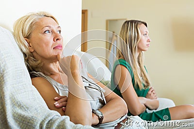 Mother and sad adult daughter having quarrel Stock Photo