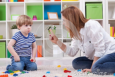 Mother scolding a disobedient child Stock Photo