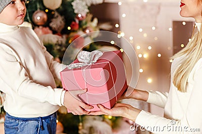 Mother and son are holding Christmas gift Stock Photo