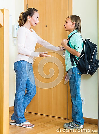 Mother and son near door Stock Photo