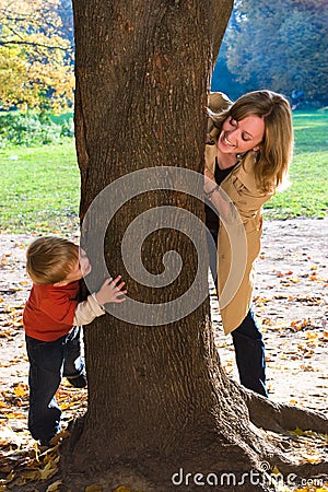 Mother and son play hide-and-seek Stock Photo