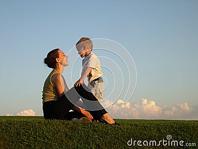 Mother with son on sundown Stock Photo