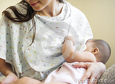 Mother is taking care of her baby Stock Photo