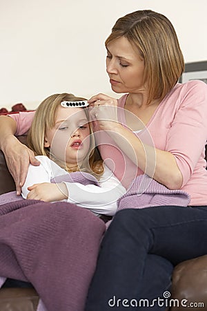 Mother Taking Temperature Of Sick Daughter Stock Photo