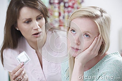 Mother Talking To Teenage Daughter About Contraception Stock Photo