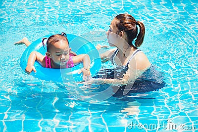 Mother teaches children swim Stock Photo