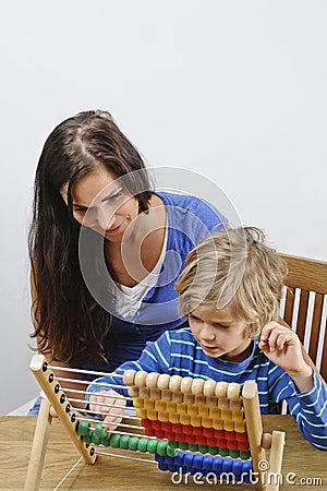 Mother teaches son Stock Photo