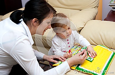 Mother teaching baby letters Stock Photo