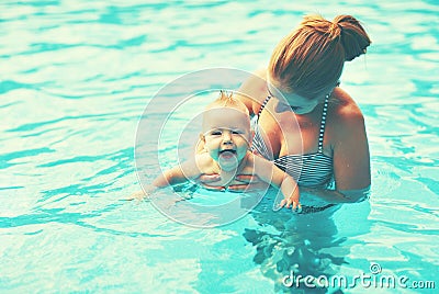 Mother teaching baby swimming pool Stock Photo