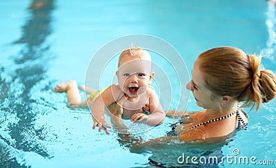 Mother teaching baby swimming pool Stock Photo