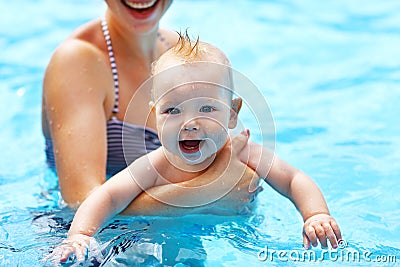 Mother teaching baby swimming pool Stock Photo