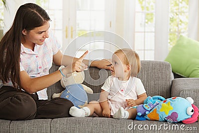 Mother teaching babygirl Stock Photo