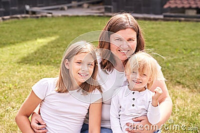 Mother with teenage daughter and little son. Outdoor family portrait. Three Stock Photo