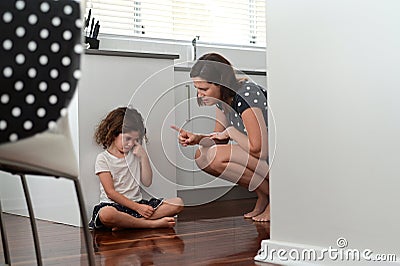 Mother telling off and discipline naughty daughter Stock Photo