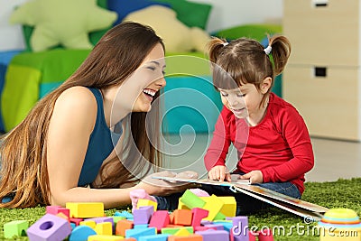 Mother and toddler playing with a book Stock Photo