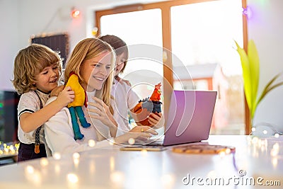 Mother trying to work from home with her kids Stock Photo