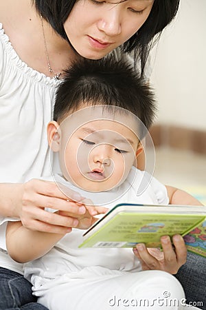 Mother tutoring her son Stock Photo