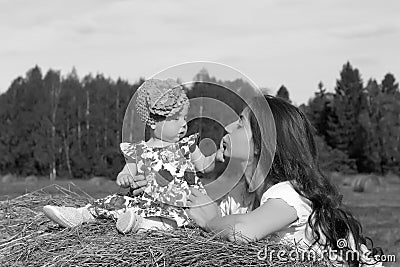 Mother with twins in field Stock Photo
