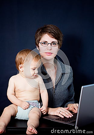 Mother working with her baby Stock Photo