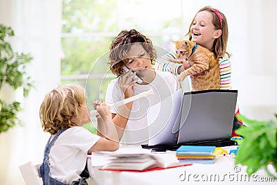 Mother working from home with kids. Quarantine Stock Photo
