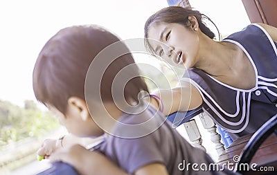 Mother worrying about her baby boy playing in corridor Stock Photo