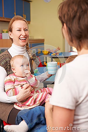Mothers With babies Chatting At Playgroup Stock Photo