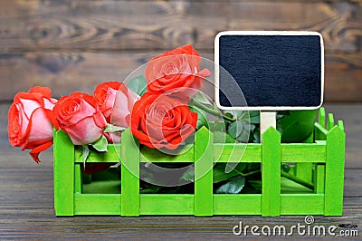 Mothers Day card with red roses and blank blackboard Stock Photo