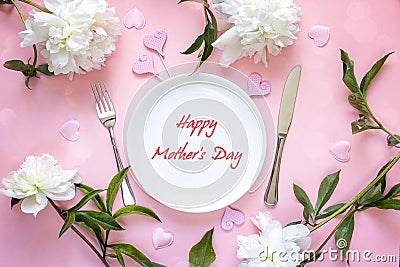 Mothers Day greeting message with table setting, white peonies a Stock Photo