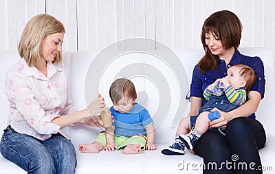 Mothers feeding babies Stock Photo