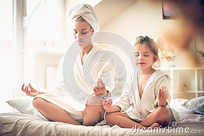 Mothers and little girl morning routine. Stock Photo