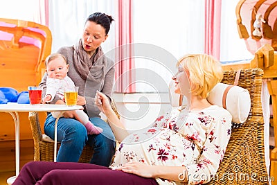 Mothers talking about pregnancy at midwife practice Stock Photo