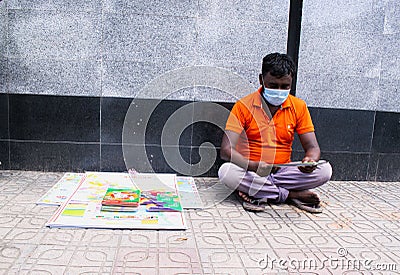 Motijheel,Dhaka Bangladesh 08/07/2020. Unknown seller Sell Book and some leaflet Editorial Stock Photo