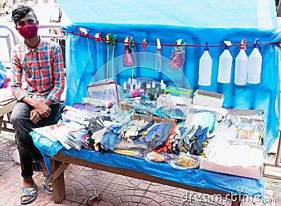 Motijheel,Dhaka Bangladesh 09/07/2020. Unknown young seller Sell Covid19,Virus protection Item Hand Sanitizer,mask,hand gloves etc Editorial Stock Photo